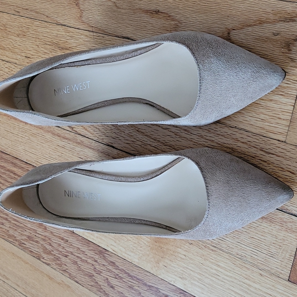 Cute low wedge pointed shoes .